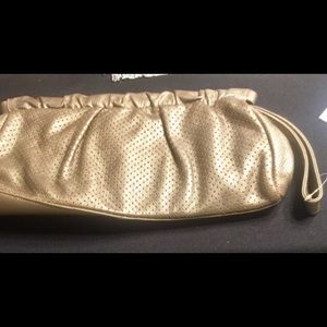 Alfani Gold Clutch Purse has never been used